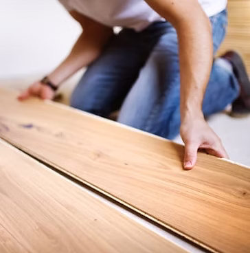 Craftsman installing hardwood flooring